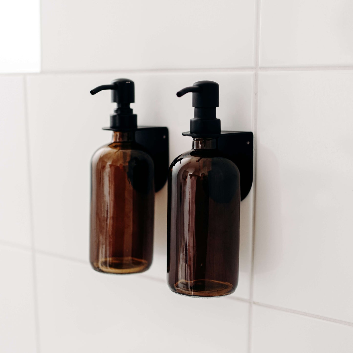 support de douche  pour un porte bouteille de savon